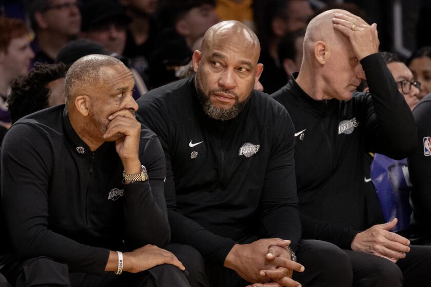 LOS ANGELES, CA - APRIL 7, 2024: Lakers head coach Darvin Ham, middle, sits on the bench.