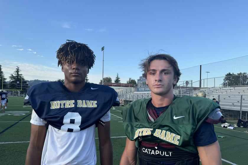 Junior receiver Luc Weaver (left) and senior quarterback Steele Pizzella of Sherman Oaks Notre Dame.