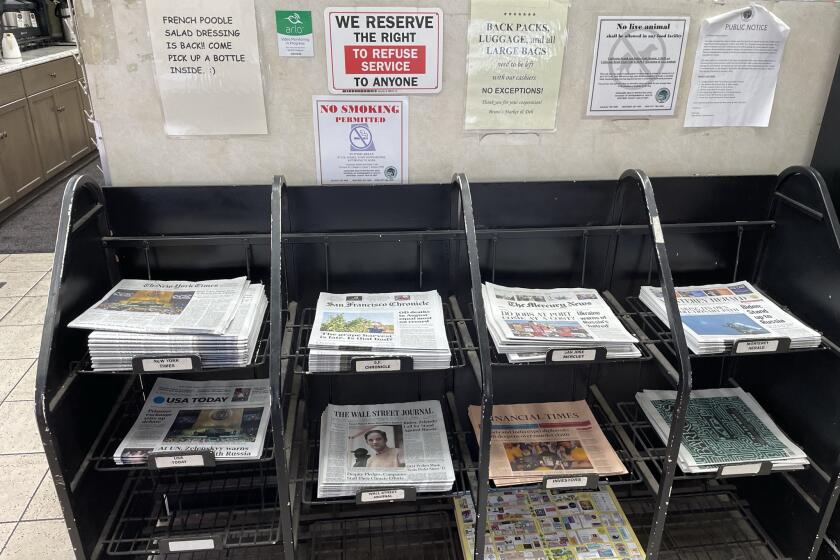 Newsrack in a Carmel, California grocery store