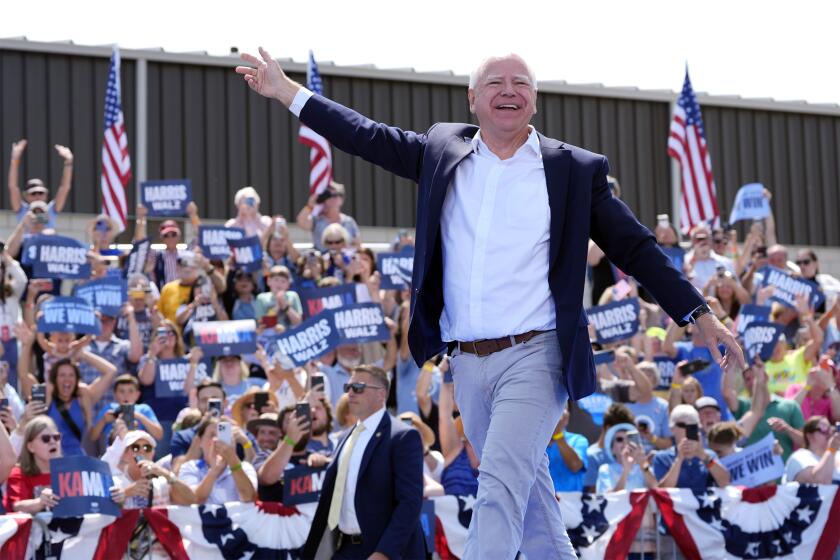 Democratic vice presidential candidate Minnesota Gov. Tim Walz arrives at a campaign rally Wednesday, Aug. 7, 2024, in Eau Claire, Wis. (AP Photo/Julia Nikhinson)