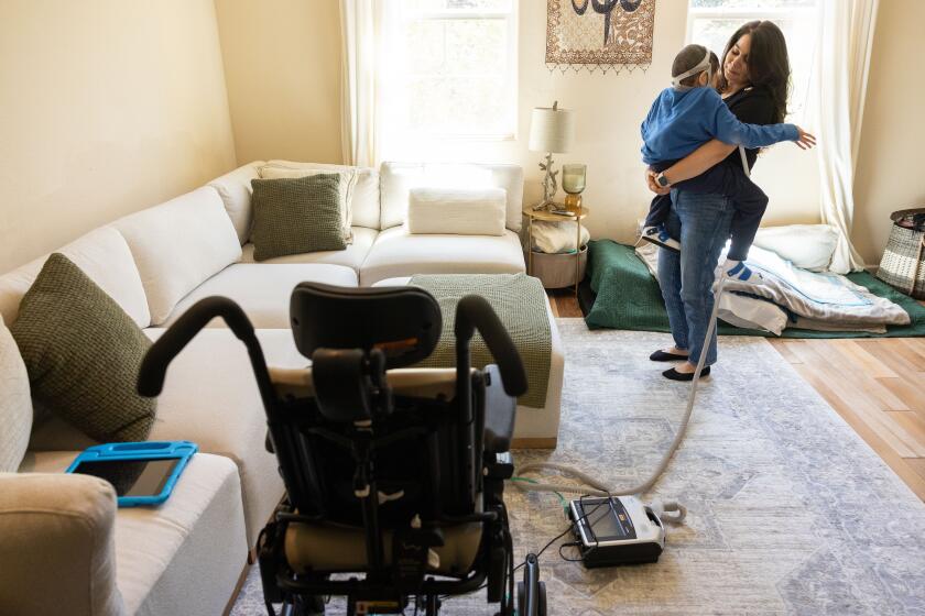 San Jose, CA - July 26: Lyla Abuebaid pauses for a moment with her 5-year-old son Sayfideen, who was diagnosed with Neonatal Marfan syndrome, at their home on Friday, July 26, 2024 in San Jose, CA. Lyla works part-time from home and is his full-time caregiver. (Peter DaSilva / For The Times)