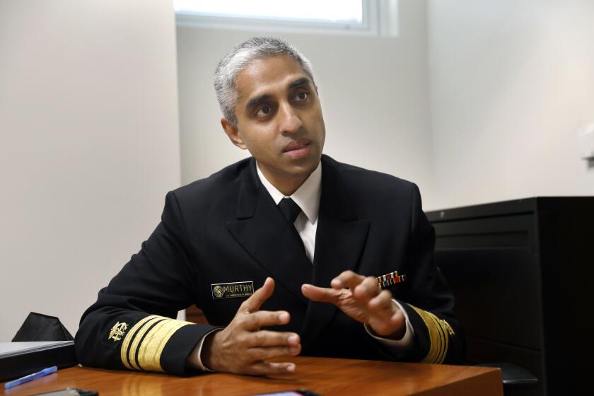 Los Angeles, California-Dec. 6, 2021-United States Surgeon General Vivek H. Murthy tours King/Drew Magnet High School of Medicine and Science before talking to a panel of students about mental health issues. United States Surgeon General Vivek H. Murthy announced a national youth mental health advisory to call attention to a situation that he considers to be a crisis among teens in the wake of the pandemic. (Carolyn Cole / Los Angeles Times)