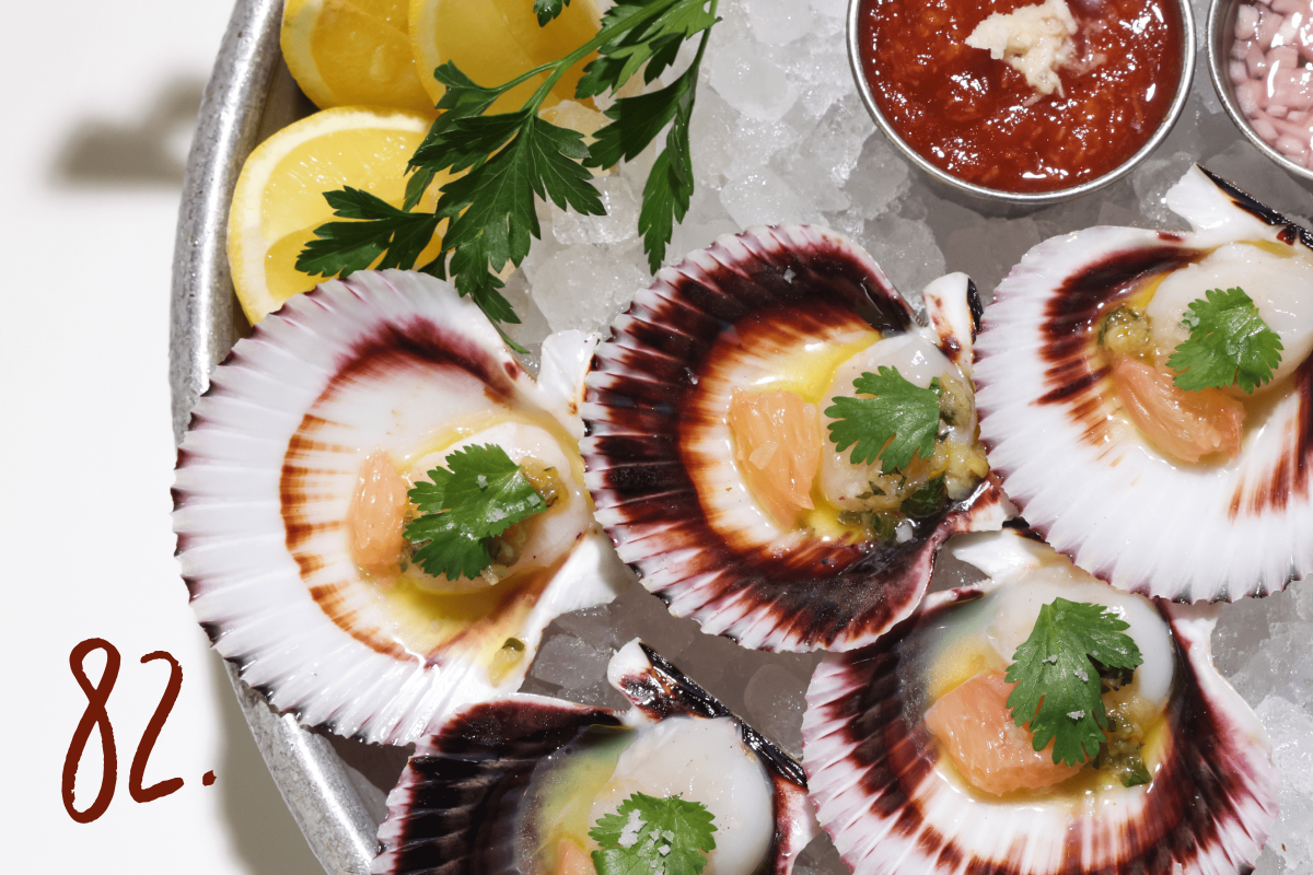 #82: Peruvian scallops on a plate with oysters