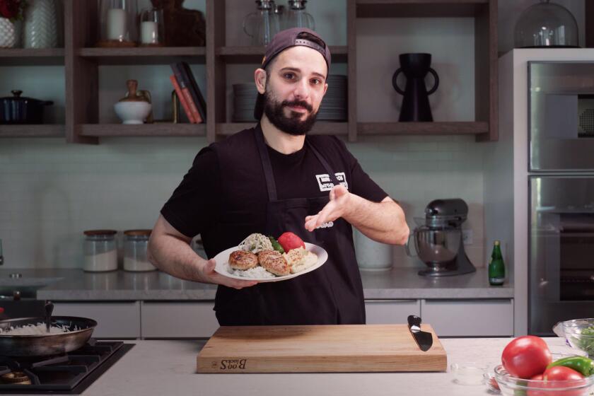 Armen Martirosyan holding his dad's chicken cutlets over a bed of rice.