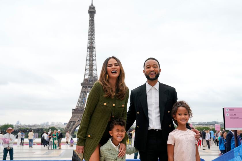 Chrissy Teigen and John Legend with their children