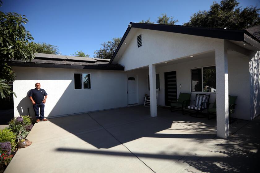 SAN FERNANDO VALLEY, CA - JULY 20, 2024 - Contractor Hector Lopez, 55, stands in front of the ADU he built for his daughter in the San Fernando Valley on July 20, 2024. It took eight months to build the 1200 square foot property. "Right now what's really pushing are ADU's," Lopez said. Lopez' family business, Bluejay Construction, has built 3 ADUs so far for family members. (Genaro Molina/Los Angeles Times)