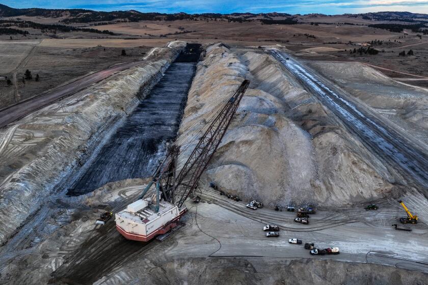 Colstrip, Montana, Monday, December 4, 2024 - One of numerous strip mining sites feeding coal to nearby Colstrip power plant. The Colstrip coal mine delivers power to Washington State and faces a possible shutdown or reduction of capacity, putting in doubt the future of a century old community that has thrived on it's existence. (Robert Gauthier/Los Angeles Times)