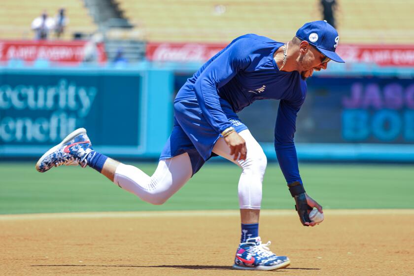 Los Angeles, CA, Saturday, July 6, 2024 - Injured Dodgers player Mookie Betts keeps his throwing arm in shape as his wrist injury continues to heal hours before a game against the Milwaukee Brewers at Dodger Stadium. (Robert Gauthier/Los Angeles Times)