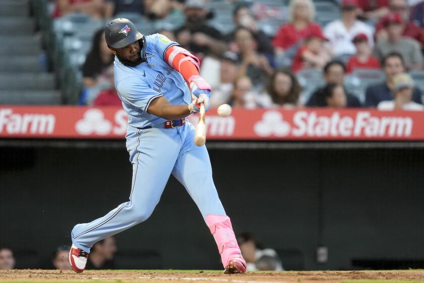 Toronto Blue Jays' Vladimir Guerrero Jr. hits a solo-home run during the third inning of a baseball game against the Los Angeles Angels, Tuesday, Aug. 13, 2024, in Anaheim, Calif. (AP Photo/Ryan Sun)