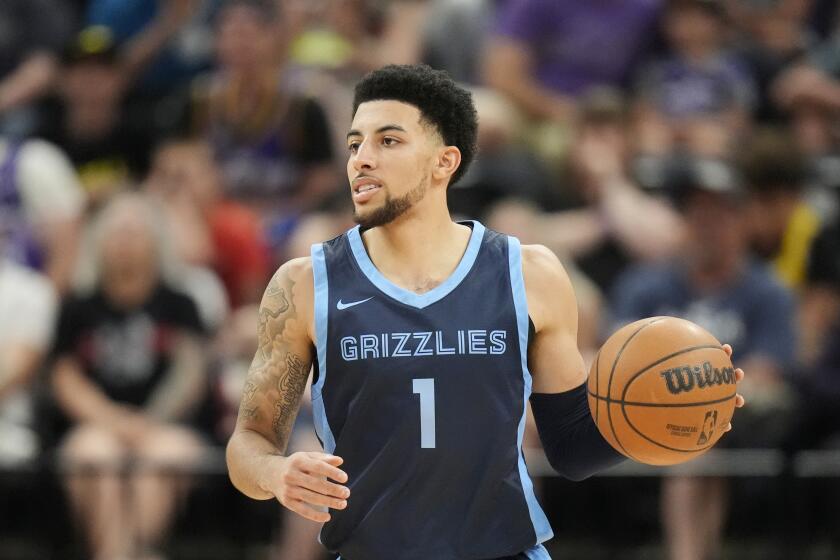 Memphis Grizzlies Scotty Pippen Jr., brings the ball up court during the second half of an NBA summer league basketball game against the Utah Jazz Monday, July 8, 2024, in Salt Lake City. (AP Photo/Rick Bowmer)