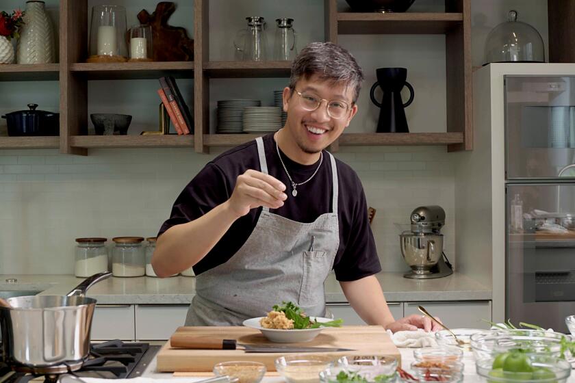 Justin Pichetrungsi finishing a plate of laab moo.