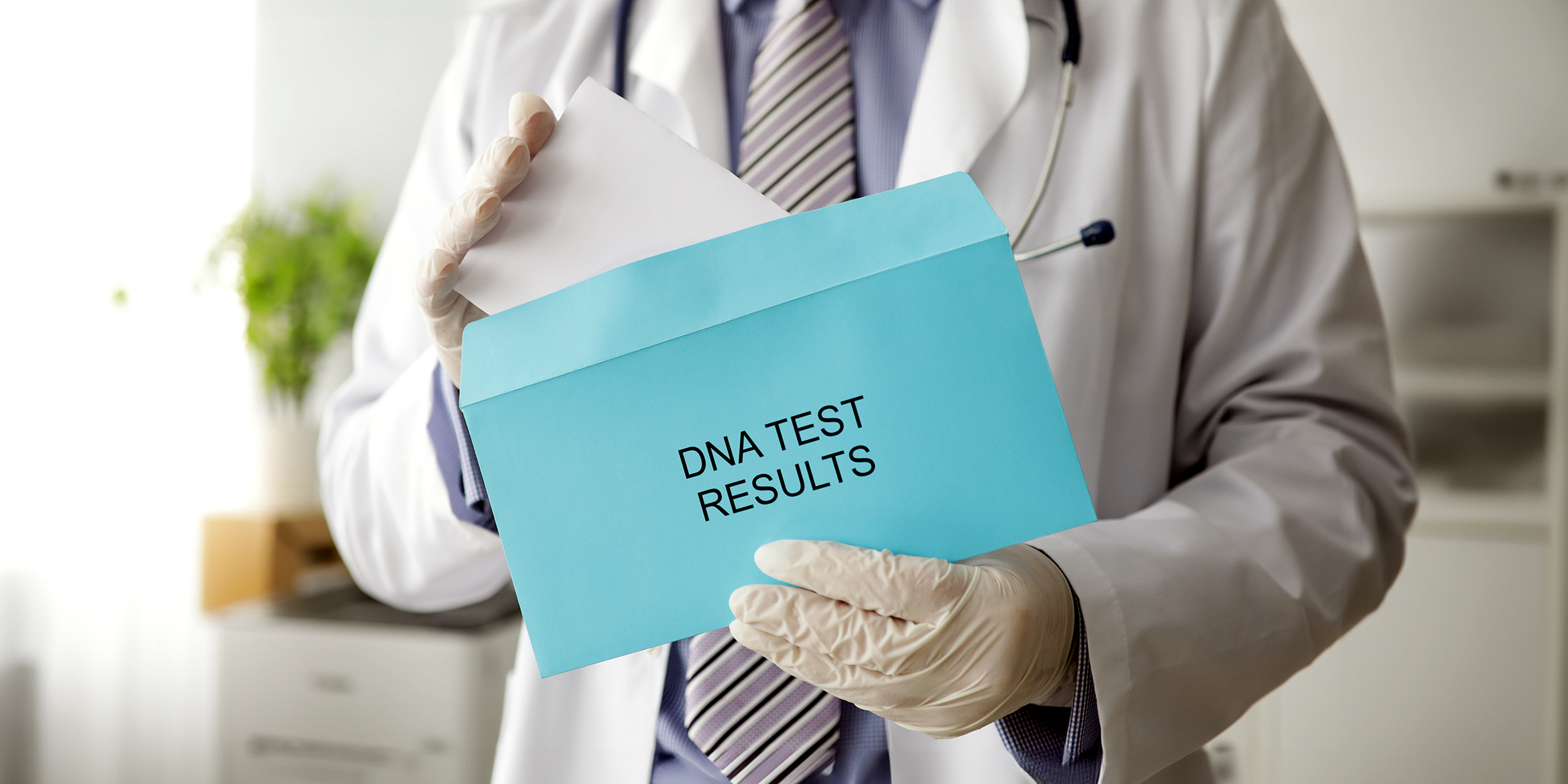 A doctor holding DNA tests | Source: Shutterstock