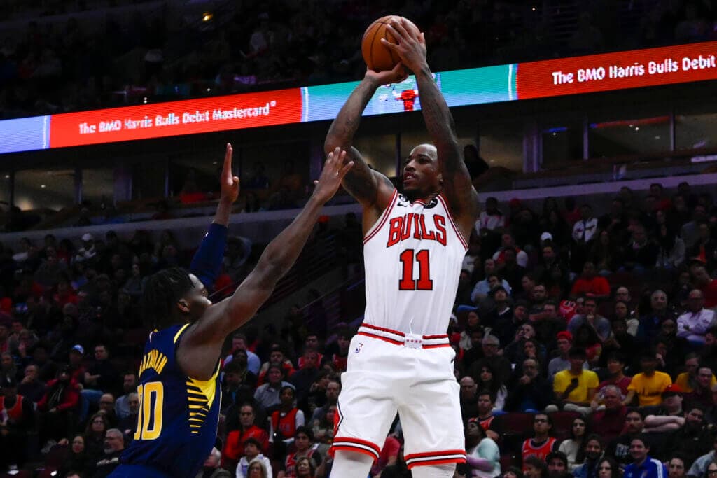 Oct 26, 2022; Chicago, Illinois, USA; Chicago Bulls forward DeMar DeRozan (11) shoots the ball over Indiana Pacers guard Bennedict Mathurin (00) during the first half at the  United Center. Mandatory Credit: Matt Marton-USA TODAY Sports