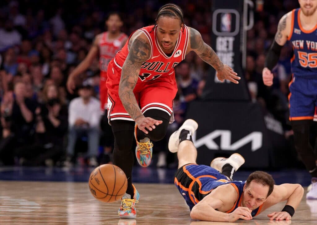 NEW YORK, NEW YORK - APRIL 14: DeMar DeRozan #11 of the Chicago Bulls makes the steal as Bojan Bogdanovic #44 of the New York Knicks loses control of the ball during the second half at Madison Square Garden on April 14, 2024 in New York City. The New York Knicks defeated the Chicago Bulls 120-119 in OT. NOTE TO USER: User expressly acknowledges and agrees that, by downloading and or using this photograph, User is consenting to the terms and conditions of the Getty Images License Agreement. (Photo by Elsa/Getty Images)