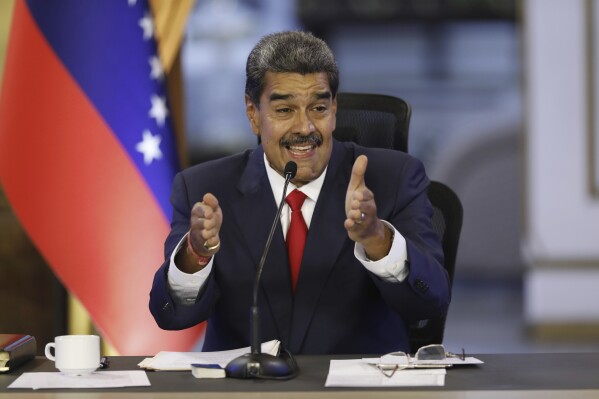 Venezuelan President Nicolas Maduro speaks during a press conference at the Miraflores presidential palace, in Caracas, Venezuela, Friday, Aug. 2, 2024. (AP Photo/Cristian Hernandez)