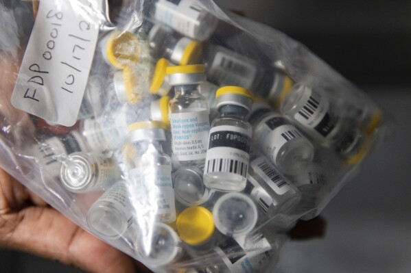 FILE - Vials of single doses of the Jynneos vaccine for monkeypox are seen from a cooler at a vaccinations site on Aug. 29, 2022, in the Brooklyn borough of New York. African health officials said mpox cases have spiked by 160% in the last year, warning the risk of further spread is high given the lack of effective treatments or vaccines on the continent. (AP Photo/Jeenah Moon, File)