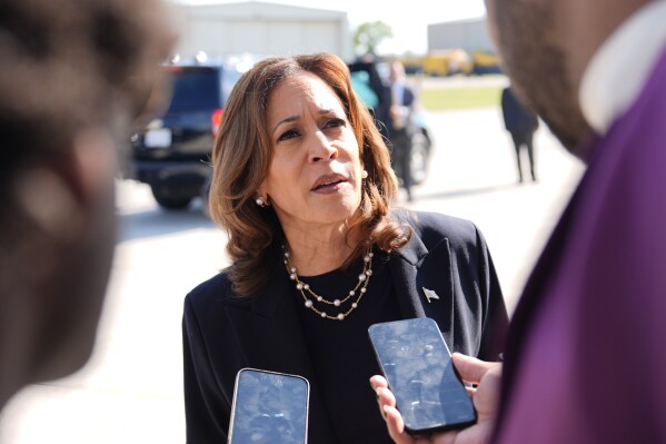 FILE - Democratic presidential nominee Vice President Kamala Harris talks to the media before boarding Air Force Two at Detroit Metropolitan Wayne County Airport, Thursday, Aug. 8, 2024, in Romulus, Mich. (AP Photo/Julia Nikhinson, File)