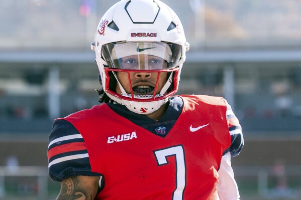 FILE - Liberty's Kaidon Salter looks on during the first half of an NCAA college football game against Massachusetts, Nov. 18, 2023, in Lynchburg, Va. (AP Photo/Robert Simmons, File)