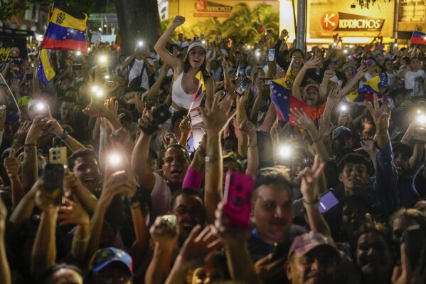 Supporters of the opposition's presidential candidate Edmundo Gonzalez cheer during his closing election campaign rally in Caracas, Venezuela, Thursday, July 25, 2024. The presidential election is set for July 28. (AP Photo/Matias Delacroix)