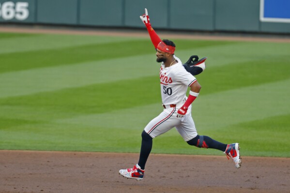 Minnesota Twins' Willi Castro runs the bases on his three-run home run against the Kansas City Royals in the second inning of a baseball game Monday, Aug. 12, 2024, in Minneapolis. (AP Photo/Bruce Kluckhohn)