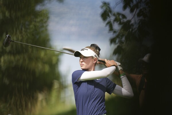 Nelly Korda plays on the seventh hole during the third round of the Evian Championship women's golf tournament, in Evian, eastern France, Saturday, July 13, 2024. (AP Photo/Laurent Cipriani)