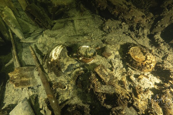 Porcelain items in a 19th century sailing ship wreckage that a team of Polish divers discovered on July 11, 2024, on the Baltic seabed about 37 kilometers (20 nautical miles) south of the Swedish isle of Öland. The ship was loaded "to the brim" with luxury goods including porcelain items and about 100 bottles of Champagne and mineral water and rests about 58 meters (190 feet) deep in conditions that the Baltictech divers say have preserved it "wonderfully." (Tomasz Stachura/Baltictech via AP)