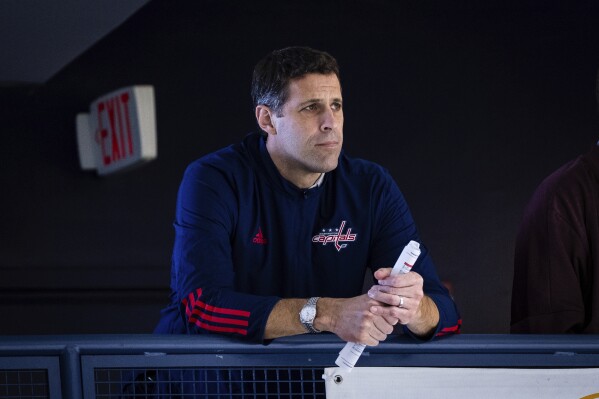 In this image provided by the Washington Capitals, Chris Patrick watches the NHL hockey club's development camp at MedStar Capitals Iceplex in Arlington, Va., Saturday, July 6, 2024. The team on Monday, July 8, named Patrick general manager with Brian MacLellan remaining president of hockey operations. (Zach Guerette/Washington Capitals via AP)