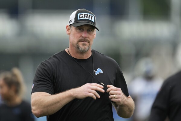 Detroit Lions head coach Dan Campbell watches during an NFL football practice in Allen Park, Mich., Wednesday, July 24, 2024. (AP Photo/Paul Sancya)