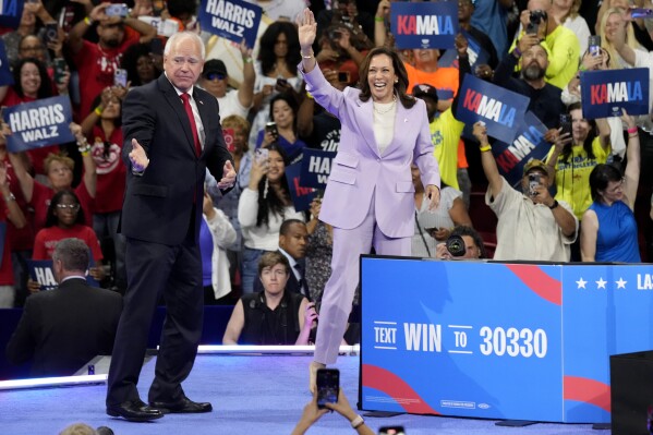 Democratic presidential nominee Vice President Kamala Harris, right, and running mate Minnesota Gov. Tim Walz are pictured at a campaign rally at the University of Nevada, Las Vegas on Saturday, Aug. 10, 2024. (AP Photo/Jae Hong)