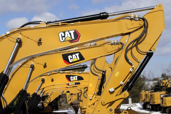 FILE - Excavator booms, adorned with the Caterpillar Inc. "CAT" logo, are displayed at the Milton CAT dealership in Londonderry, N.H., Feb. 20, 2020. On Friday, July 12, 2024, the Labor Department releases producer prices data for June, 2024. (AP Photo/Charles Krupa, File)