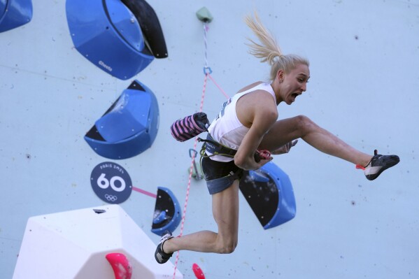 Janja Garnbret of Slovenia competes in the women's boulder and lead, lead final, during the sport climbing competition at the 2024 Summer Olympics, Saturday, Aug. 10, 2024, in Le Bourget, France. (AP Photo/Tsvangirayi Mukwazhi)