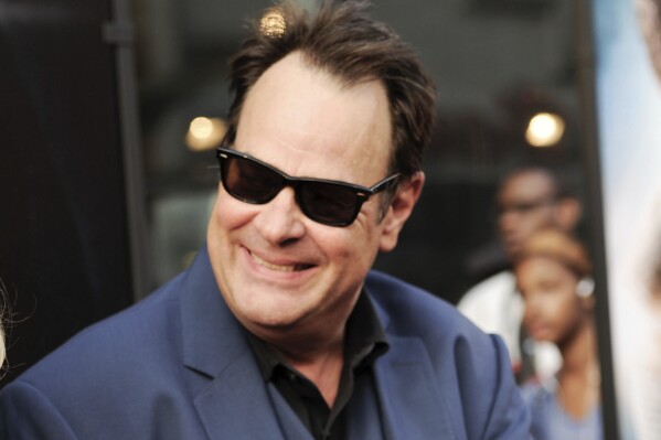 FILE - Dan Aykroyd attends the world premiere of "Get On Up" in New York on July 21, 2014. Aykroyd writes and narrates the Audible Original “Blues Brothers: The Arc of Gratitude,” which starts with him meeting John Belushi in 1973. (Photo by Evan Agostini/Invision/AP, File)