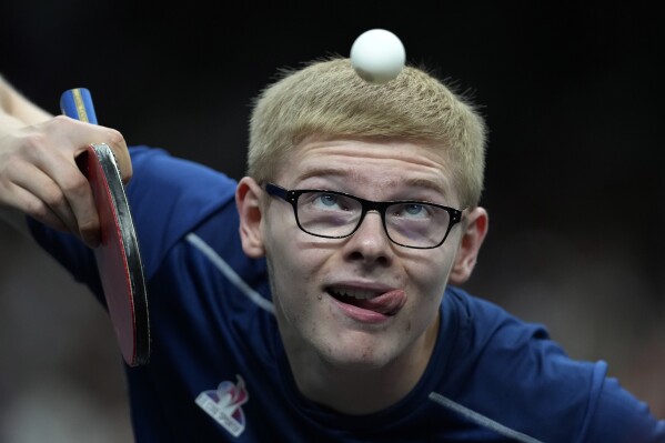 France's Felix Lebrun plays against Sweden's Anton Kallberg during a men's singles round of 32 table tennis game at the 2024 Summer Olympics, Monday, July 29, 2024, in Paris, France. (AP Photo/Petros Giannakouris)