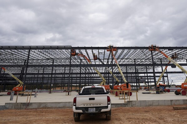 FILE - JLG lifts are operated outside a Hanwha QCells Solar plant Oct. 16, 2023, in Cartersville, Ga. (AP Photo/Mike Stewart, File)