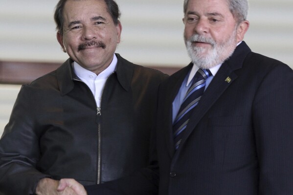 FILE - Nicaragua's President Daniel Ortega, left, shakes hands with Brazil's President Luiz Inacio Lula da Silva at Itamaraty palace in Brasilia, Brazil July 28, 2010. (AP Photo/Eraldo Peres, File)