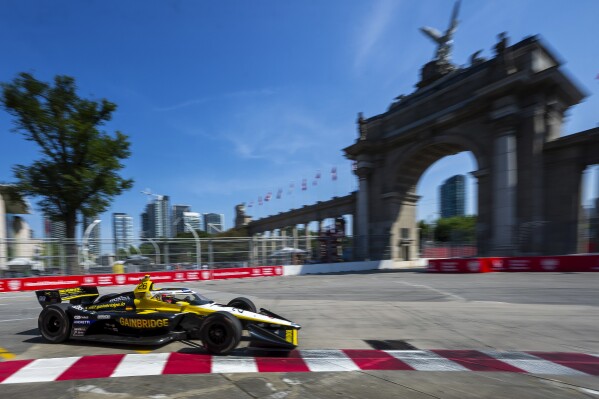 Colton Herta zooms around the track on his way to the fastest time during practice for the IndyCar auto race, Saturday July 20, 2024, in Toronto. (Frank Gunn/The Canadian Press via AP)