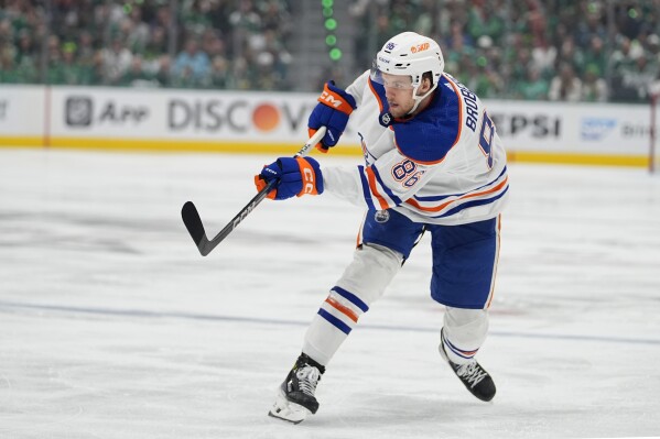 FILE - Edmonton Oilers defenseman Philip Broberg shoots against the Dallas Stars during the second period of Game 5 of the Western Conference finals in the NHL hockey Stanley Cup playoffs Friday, May 31, 2024, in Dallas. (AP Photo/Julio Cortez, File)