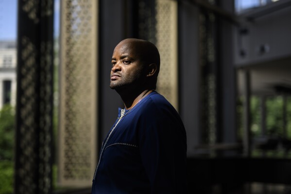 Pascal Kanyemera is shown at the National Arts Centre in Ottawa, Ontario, Canada, on Wednesday, July 17, 2024. Kanyemera has no doubts: Back in 1994, when he survived the genocide against the Tutsi in Rwanda, God had his back. (AP Photo/Justin Tang)