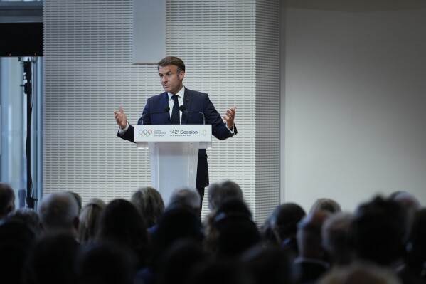 French President Emmanuel Macron speaks, during the IOC Session Opening Ceremony at the Louis Vuitton Foundation ahead of the 2024 Summer Olympics, Monday, July 22, 2024, in Paris, France. (AP Photo/Thibault Camus)