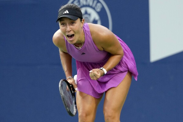 Jessica Pegula, of the United States, celebrates after her win over Amanda Anisimova, also of the United States, in women's singles final action at the National Bank Open tennis tournament in Toronto, Monday, Aug. 12, 2024. (Frank Gunn/The Canadian Press via AP)