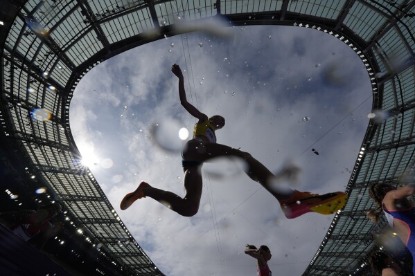 Cara Feain-Ryan, of Australia, competes in a heat of the women's 3000-meter steeplechase at the 2024 Summer Olympics, Sunday, Aug. 4, 2024, in Saint-Denis, France. (AP Photo/Matthias Schrader)