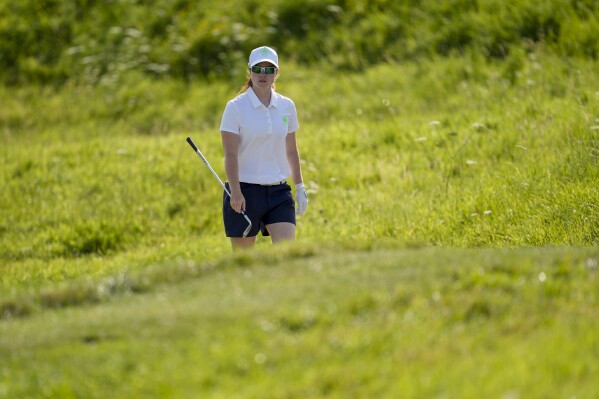 Leona Maguire, of Ireland, walks to the 12th tee during a practice round of the women's golf event at the 2024 Summer Olympics, Tuesday, Aug. 6, 2024, at Le Golf National in Saint-Quentin-en-Yvelines, France. (AP Photo/George Walker IV)