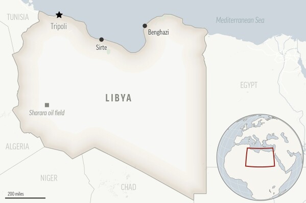 FILE - A view of a locator map for Libya with its capital, Tripoli. Libyan officials say clashes between two heavily armed militia groups in the country’s capital terrorized residents and killed about a dozen people, the latest bout of violence in the largely lawless North African nation. (AP Photo, File)