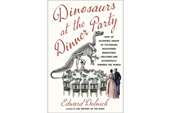 This cover image released by Scribner shows "Dinosaurs at the Dinner Party: How an Eccentric Group of Victorians Discovered Pregistoric Creatures and Accidentally Upended the World" by Edward Dolnick. (Scribner via AP)