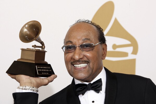 FILE - Duke Fakir holds his life time achievement award backstage at the 51st Annual Grammy Awards in Los Angeles on Feb. 8, 2009. Fakir wrote a memoir, "I'll Be There: My Life With The Four Tops." Fakir, the last of the original Four Tops, died Monday of heart failure at age 88.(AP Photo/Matt Sayles, File)