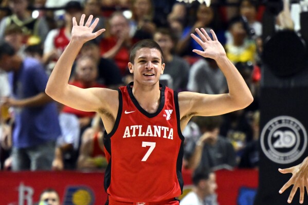 Atlanta Hawks forward Nikola Druidic (7) reacts after a basket against the Washington Wizards during the first half of an NBA summer league basketball game Friday, July 12, 2024, in Las Vegas. (AP Photo/David Becker)