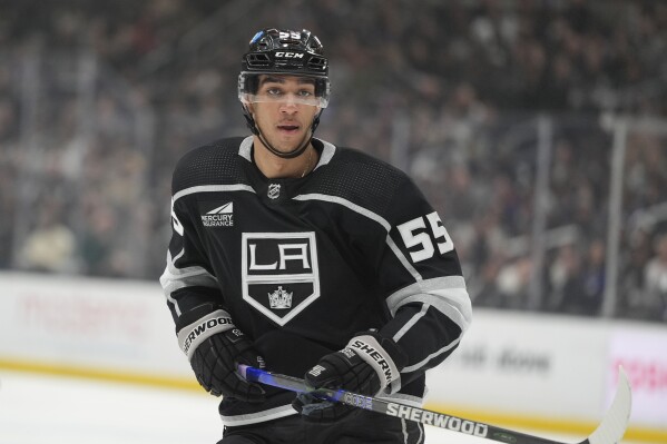 FILE - Los Angeles Kings right wing Quinton Byfield skates during the second period of an NHL hockey game against the Tampa Bay Lightning, March 23, 2024, in Los Angeles. Byfield has agreed to a five-year, $31.25 million contract extension with the Kings. The team announced the deal Monday, July 15, 2024, for Byfield, the No. 2 overall pick in the 2020 NHL draft. The contract runs through the 2028-29 season. (AP Photo/Jae C. Hong, File)