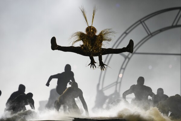 Artists perform during the 2024 Summer Olympics closing ceremony at the Stade de France, Sunday, Aug. 11, 2024, in Saint-Denis, France. (AP Photo/Ashley Landis)