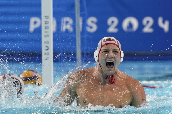 United States' Hannes Daube celebrates after scoring against Hungary during the men's water polo bronze medal match at the 2024 Summer Olympics, Sunday, Aug. 11, 2024, in Paris, France. (AP Photo/Luca Bruno)