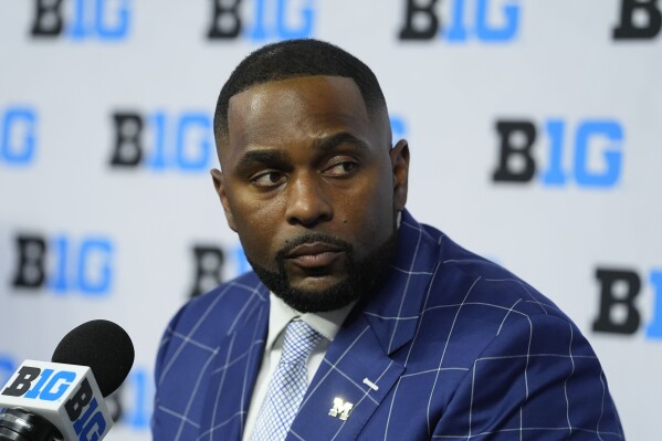 Michigan head coach Sherrone Moore speaks during an NCAA college football news conference at the Big Ten Conference media days at Lucas Oil Stadium, Thursday, July 25, 2024, in Indianapolis. (AP Photo/Darron Cummings)